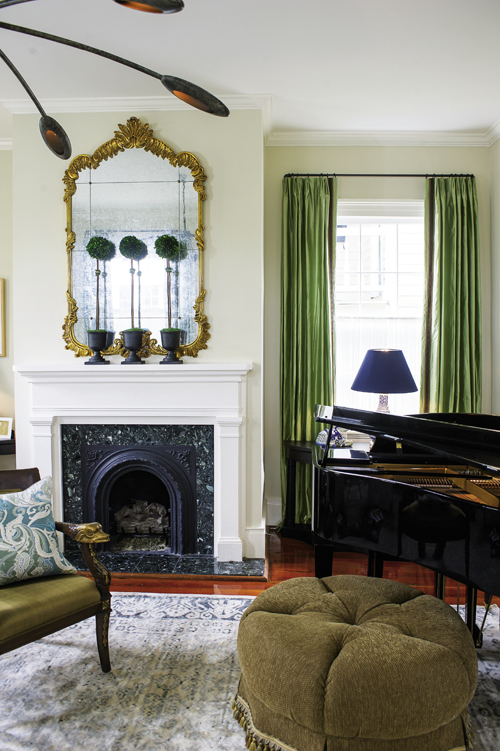 In the parlor, kiwi-green drapes reference Charleston’s lush landscape.
