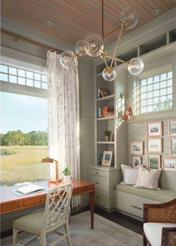 In Susan&#039;s office the walls are painted in Farrow &amp; Ball “French Gray,” a Hickory Chair desk, and Visual Comfort bubble lamp light fixture add feminine flair.