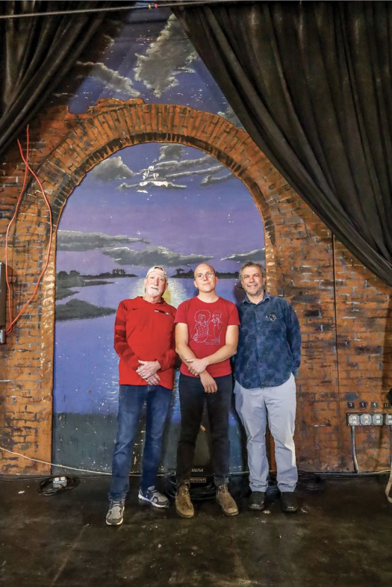 TO THE FUTURE: Charleston Music Hall and Music Farm director Charles Carmody (center) joins building owners Mark Cumins and Jerry Scheer near the David Boatwright mural, which will remain.