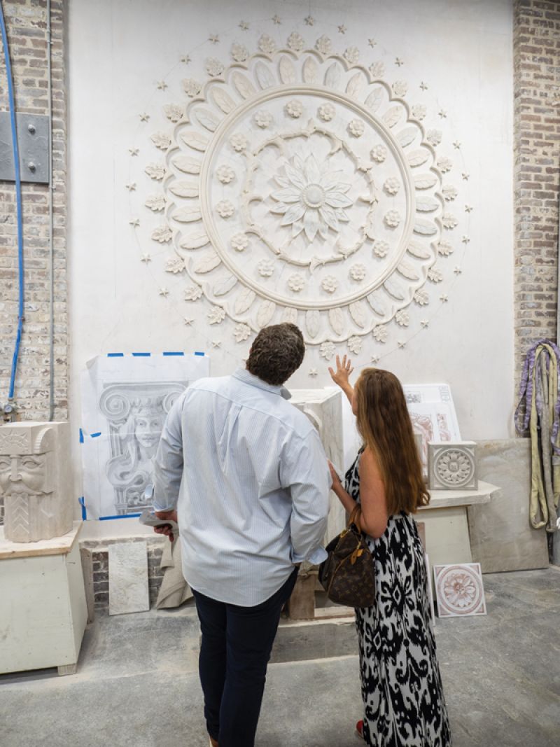 Guests admire a replica of the plaster ceiling medallion at Drayton Hall.