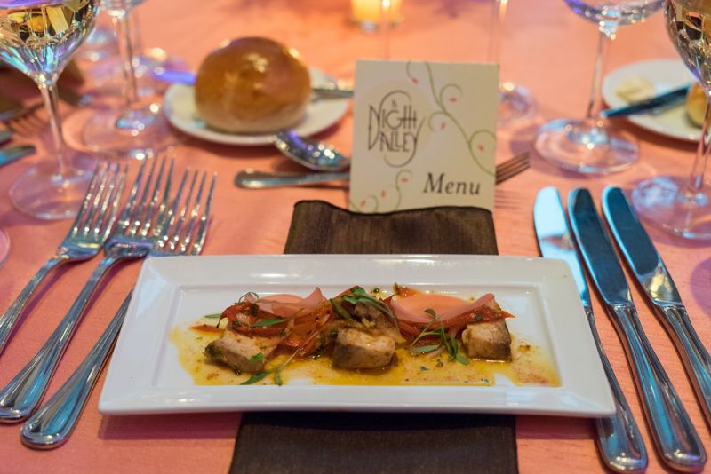 Escabéche of open blue cobia with julienned peppers, micro greens, and radishes