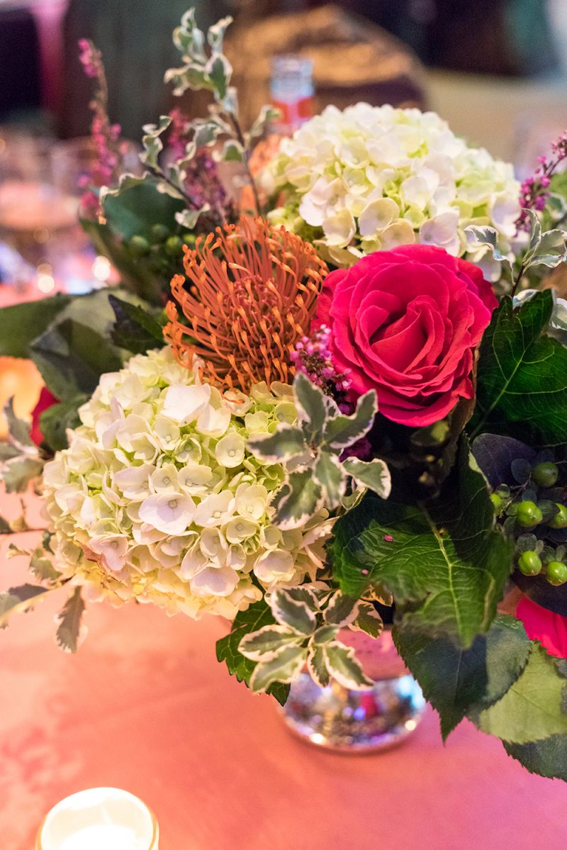 Flower arrangements graced each table.