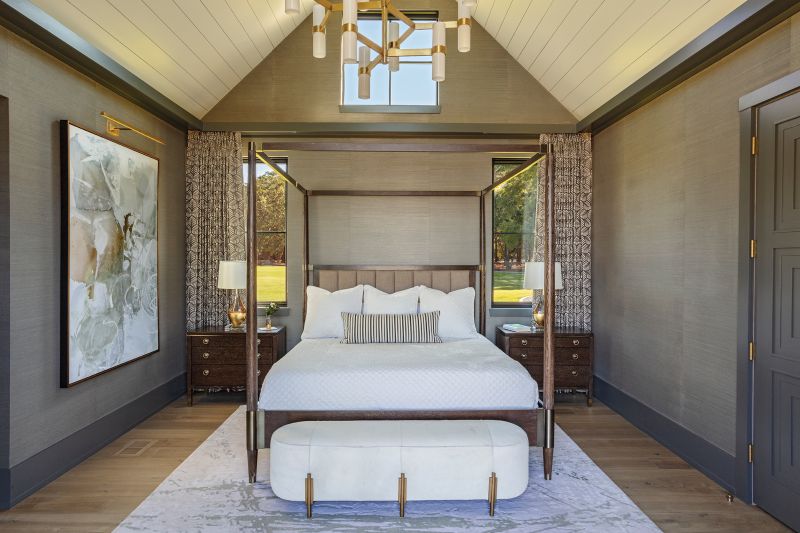 A Bernhardt four-poster bed is positioned to enjoy a scene of oak trees and sunsets through the French doors.