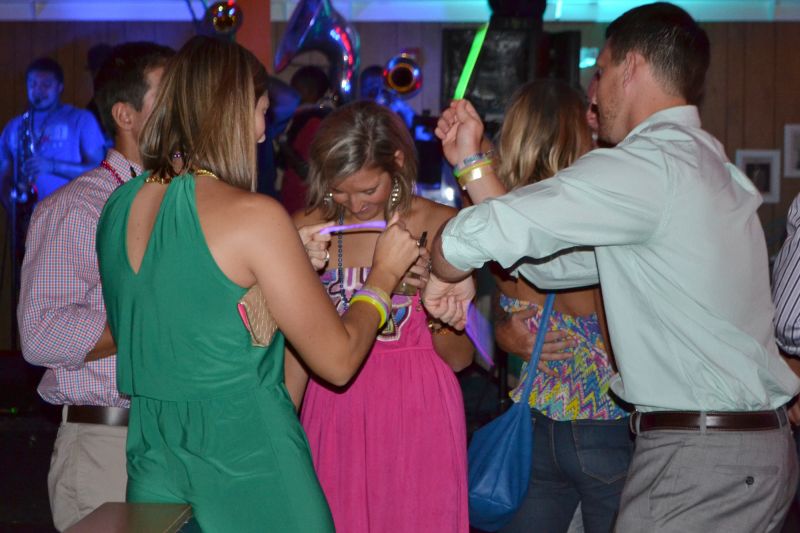 Colorful glow sticks waved in the air as guests danced around with friends.