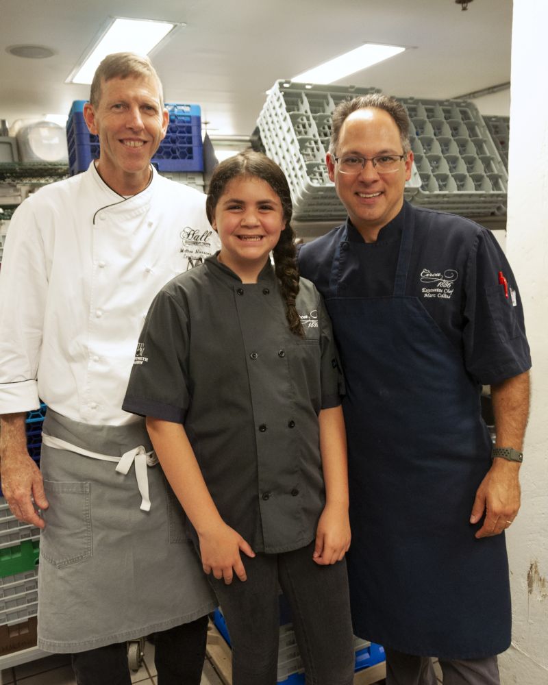 Head Chef Matthew Neissner of Halls Management Group, Little Chef Ella Bruno, and Big Chef Marc Collins of Circa 1886 in the kitchen.