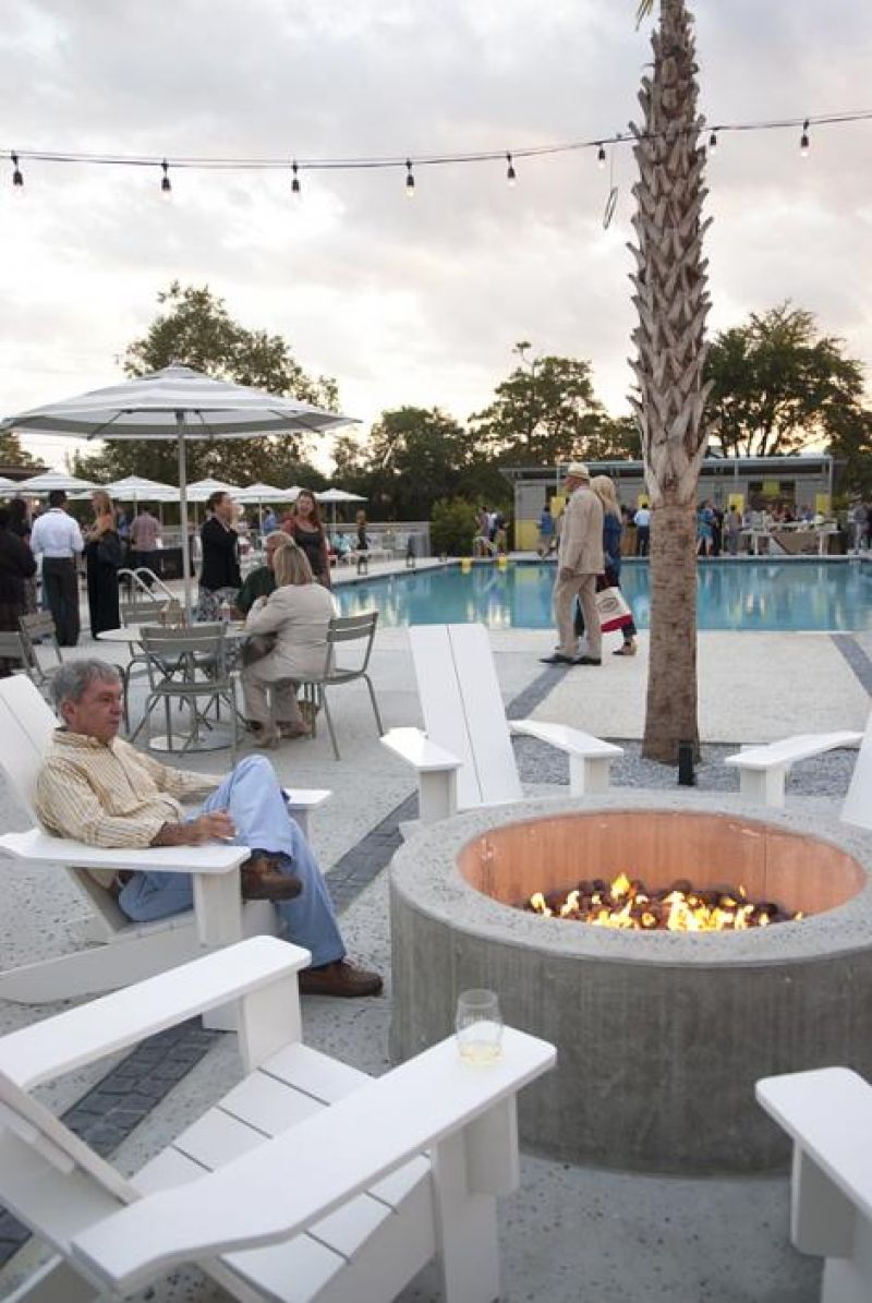 Guest warmed themselves by the fire pit as the air turned cool