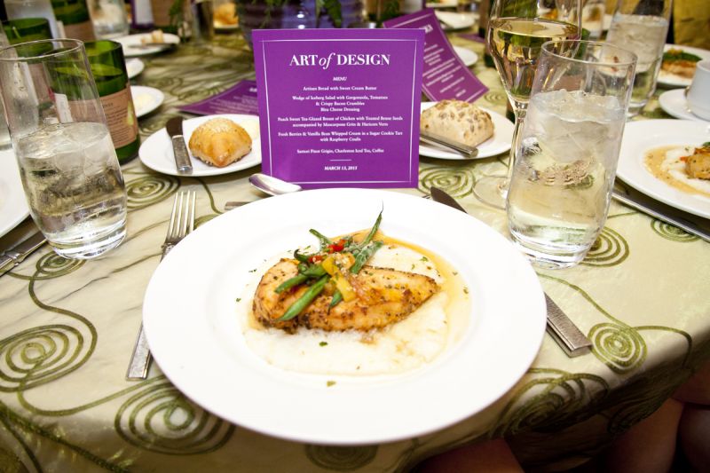 Peach sweet tea-glazed chicken with toasted benne seeds accompanied by mascarpone grits and haricots verts