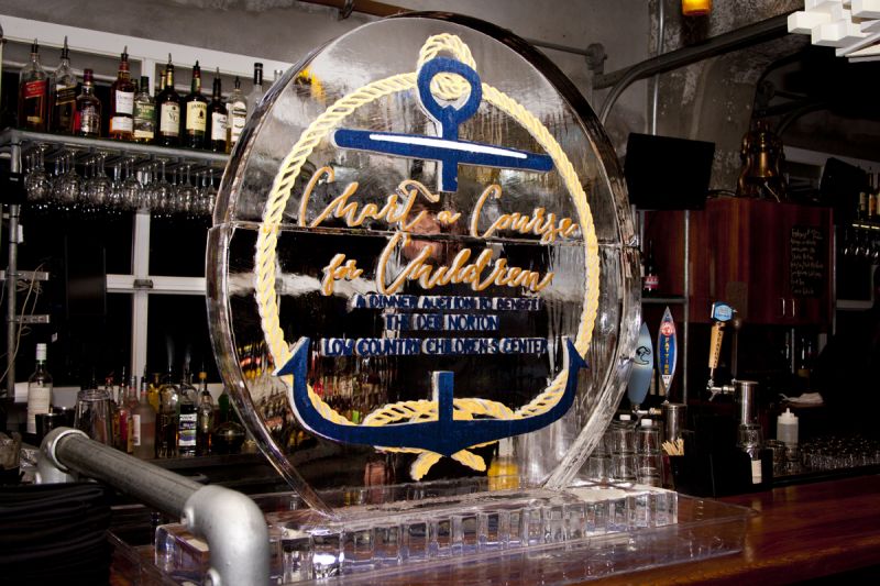 A large ice sculpture sat perched on the bar, commemorating the night&#039;s dinner auction and purpose.