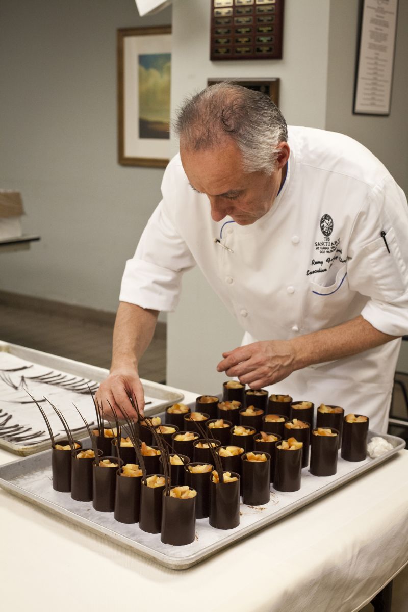 The Kiawah Sanctuary&#039;s pastry chef Remy Funfrock assembled his dessert, bittersweet Venezuelan chocolate parfait with caramel poached seckel pear and honey saffron ice cream.