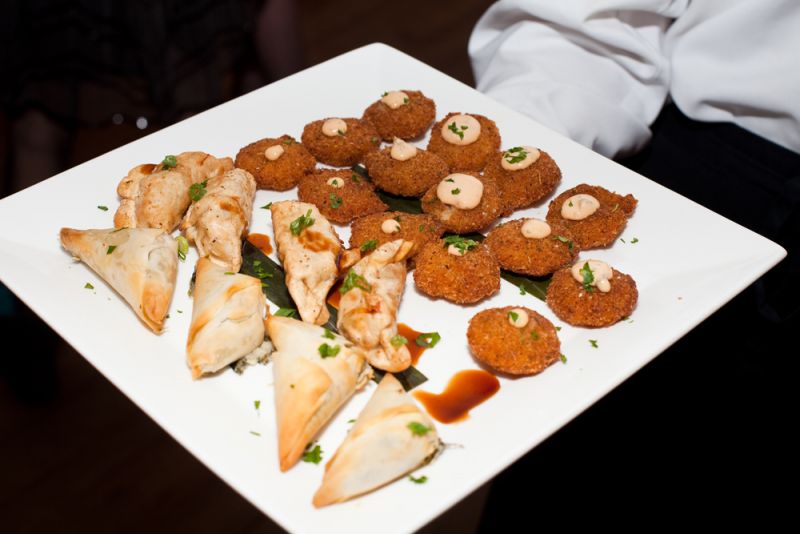 Hors d&#039;oeuvres including fried green tomatoes, chicken dumplings, and spinach borsin were passed around for guests to enjoy.