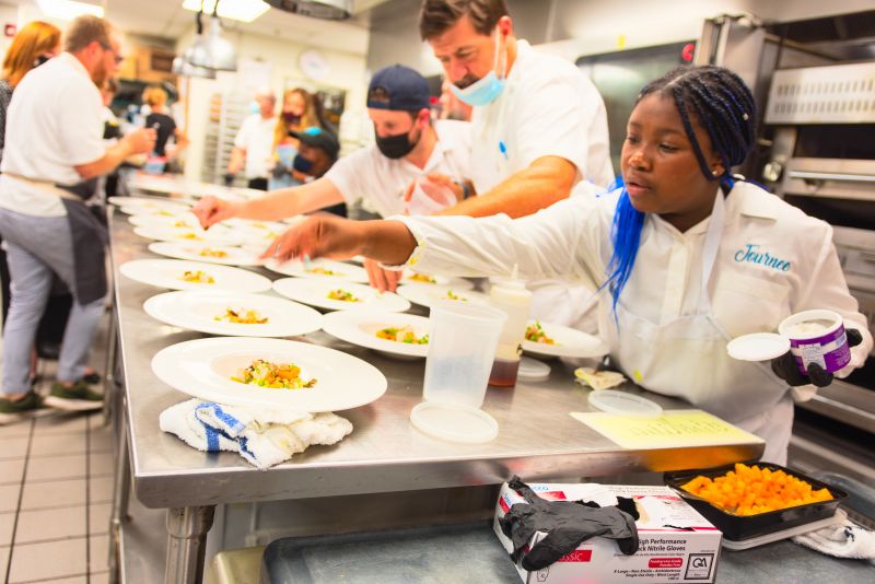 Journee Myers plates their dish....