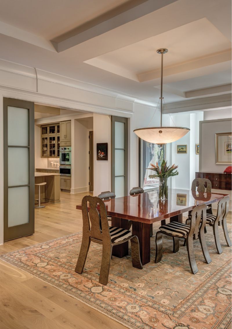 AN EYE FOR DETAIL: A collection of Knoll dining chairs by the famed American architect Robert Venturi surround the dining table.