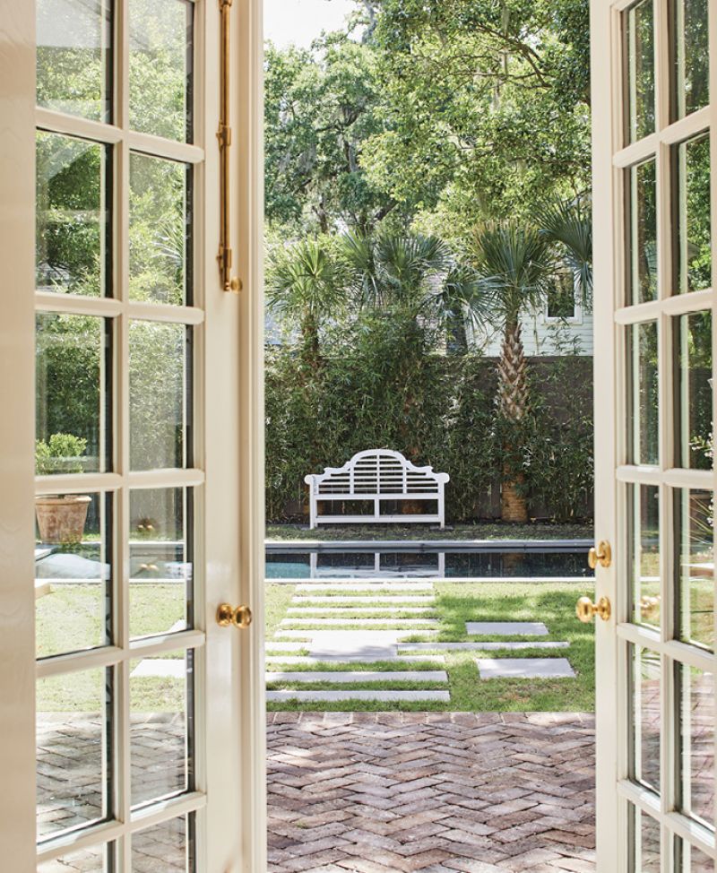 The Great-looking Outdoors: Laughlin added two sets of French doors to the rear of the home, filling the first floor with natural light and providing easy thoroughfares to the backyard oasis.