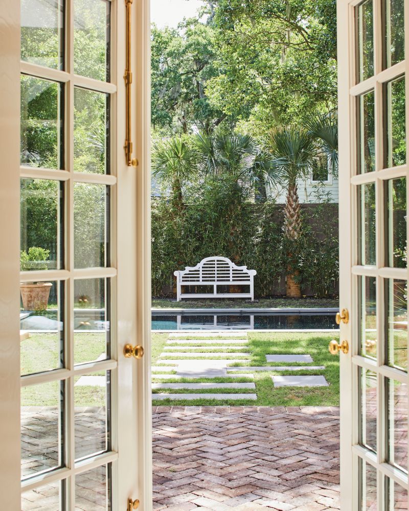 Laughlin added two sets of French doors to the rear of the home, filling the first floor with light and providing easy thoroughfares to the backyard oasis.