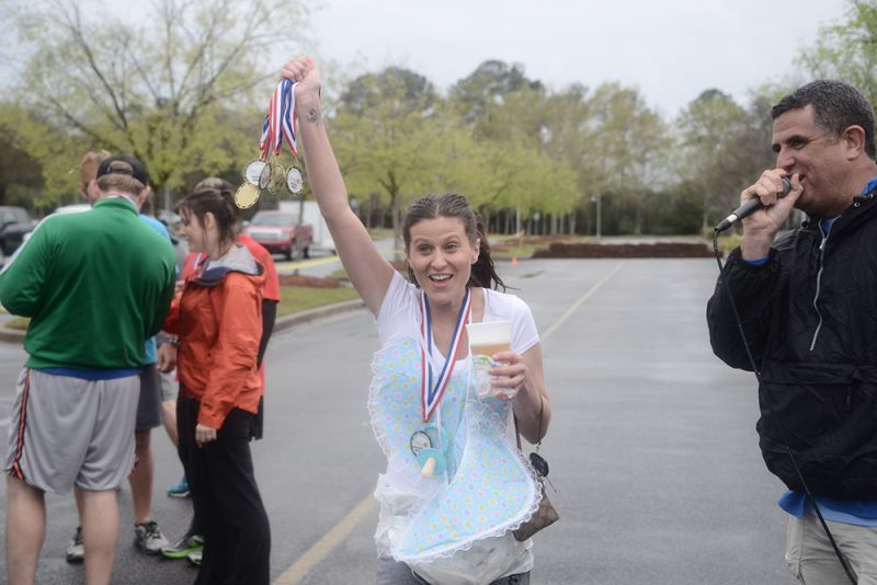 Baby Nicole sipped a cold one as she accepted the medals for the Cradle Robbers.