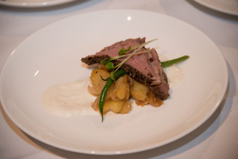 GRAZE served bites of sous vide prime rib confit, fingerling potatoes, Cipollino onions, sunflower sprouts and horseradish creme fraiche.