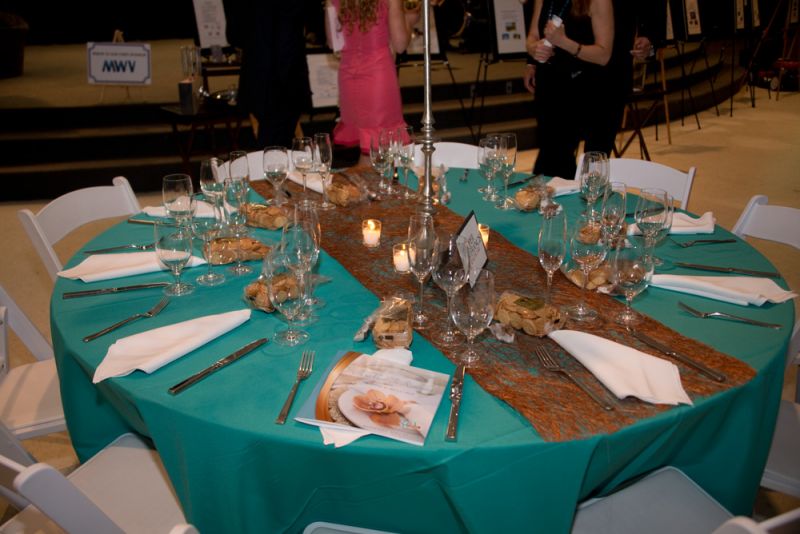 Many tables stayed empty throughout the silent auction while guests milled throughout the hall, monitoring their bets and greeting one another.