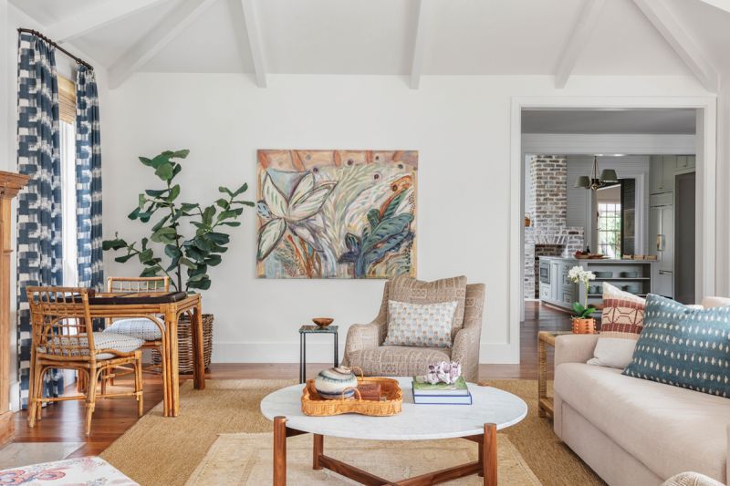 The expansive family room occupies the addition, where floor-to-ceiling windows and a vaulted ceiling create a light, bright space.