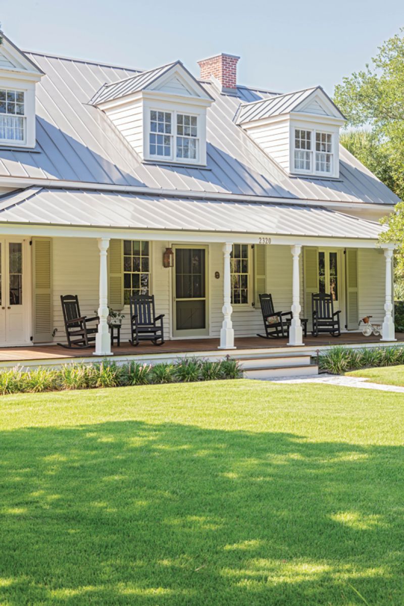 Owners Melissa and Jay Healy were determined to restore as much of its original aesthetic as possible, including the wide front porch with original wooden columns. Prior to the restoration, the columns sat on contemporary slab and modern brick. Beau Clowney Architects and builder Greg St. Pierre were able to incorporate the original columns with a new front porch that looks as if it has been there for generations.
