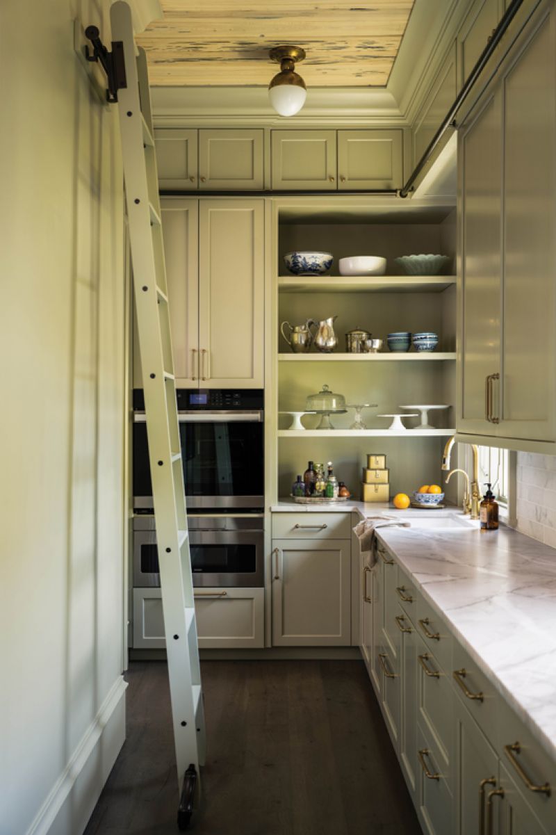 Party Pantry: An avid chef, Susan uses every inch of the pantry to store her dishes and serving ware. Built by Hostetler Custom Cabinetry, the pale green cabinets pop against the white quartzite countertops.