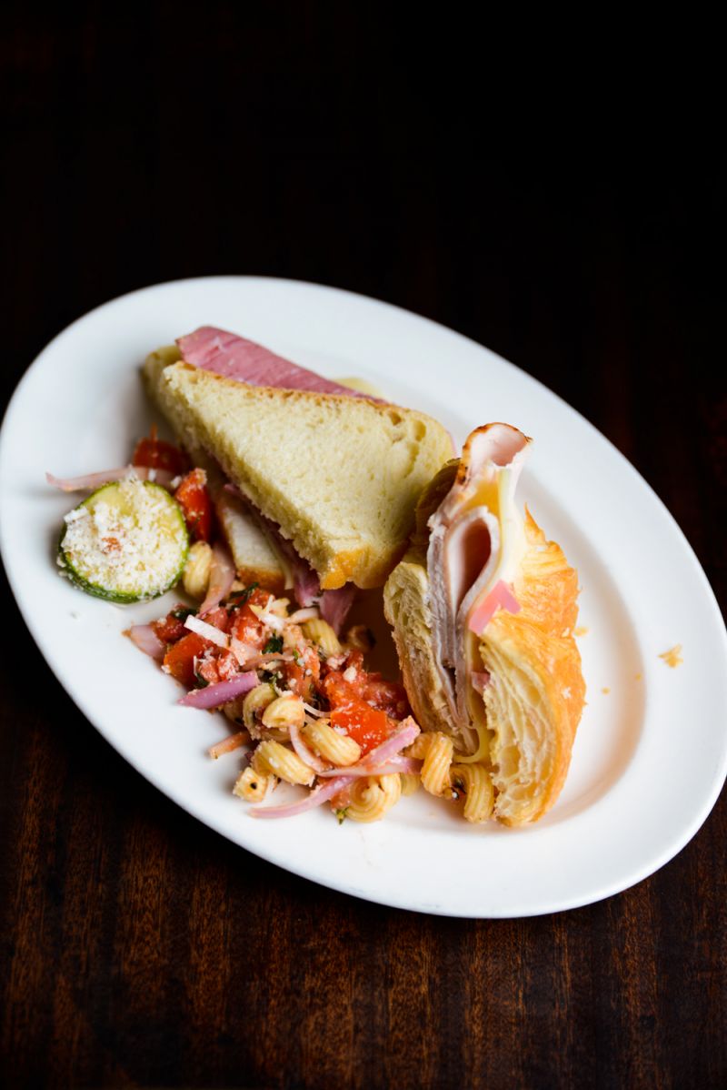 Complimentary plate with sandwiches and pasta salad