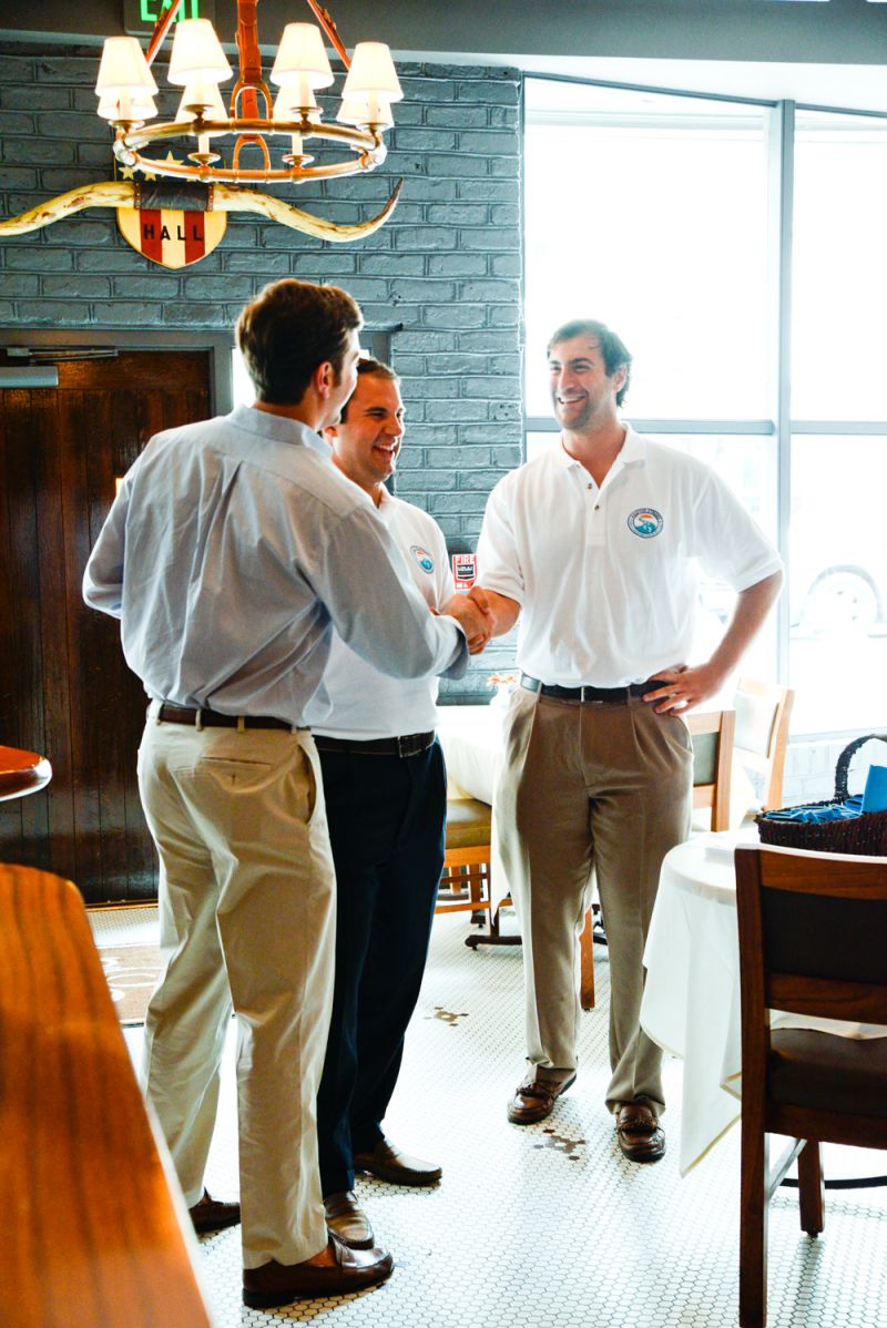 Director Tyler Brant greets a donor