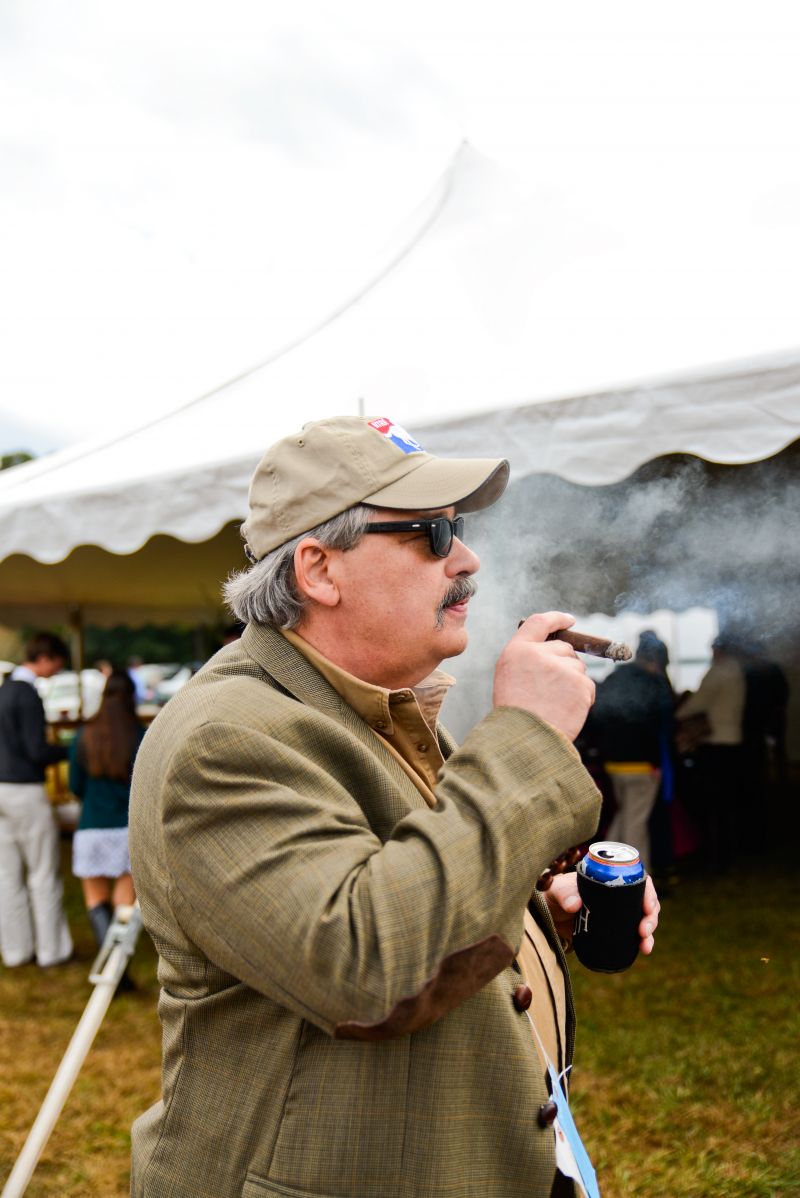 Charles Strickland enjoys a cigar