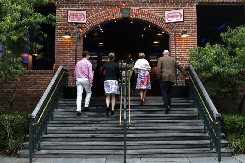 The entrance to the Charleston Visitors Center Bus Shed was strung with lights, setting the scene for the French-inspired evening.