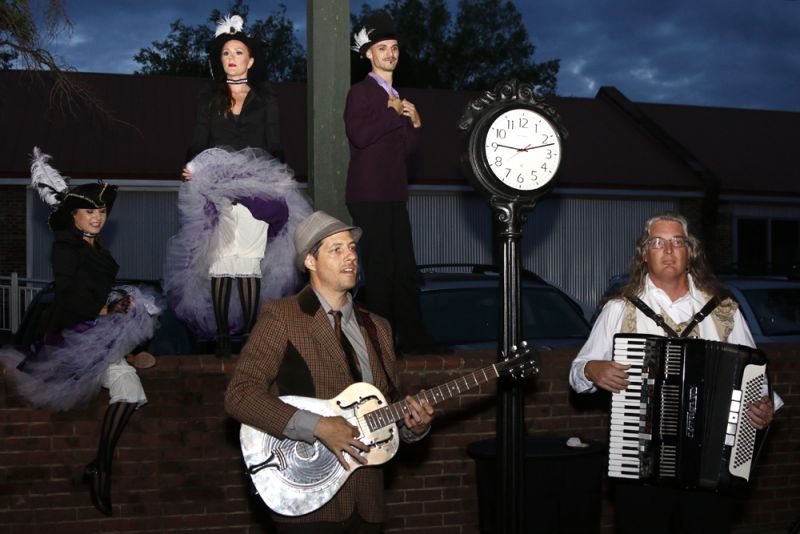 Costumed dancers performed as street musicians played lively tunes.