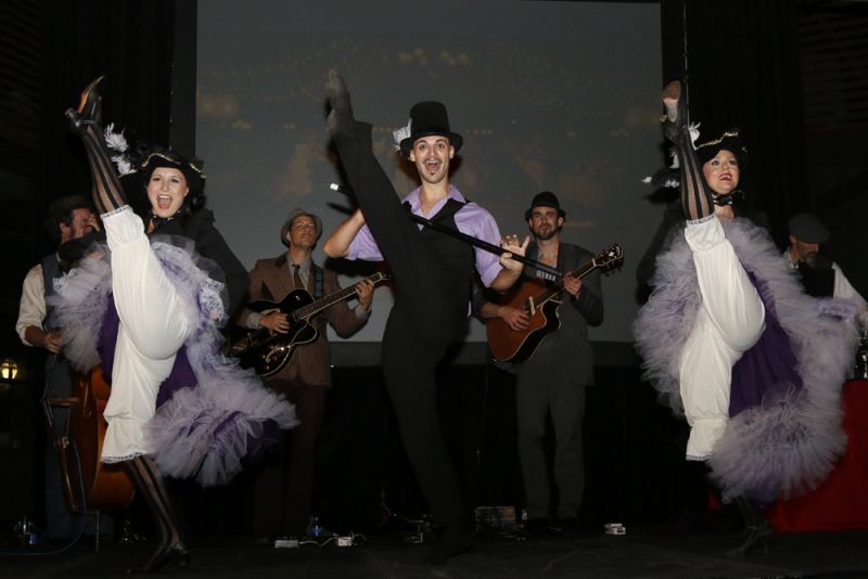 Cabaret dancers performed a comical piece on the stage, high-kicking to the delight of the audience.