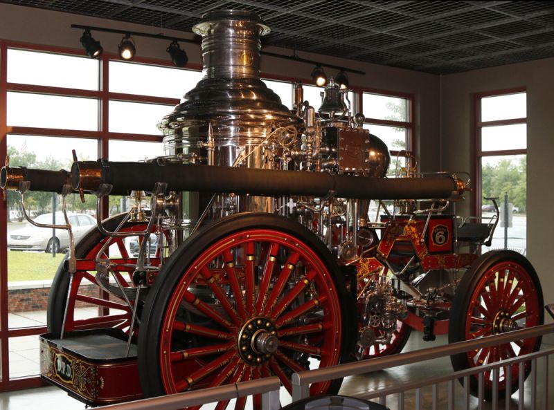 A classic fire engine sits in the window of the North Charleston and American LaFrance Fire Museum.