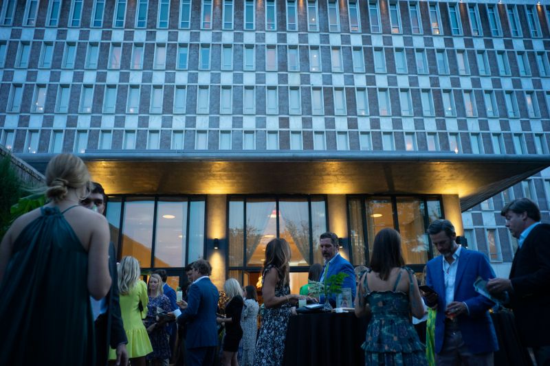 Guests mingled in the Dewberry Hotel’s walled garden.