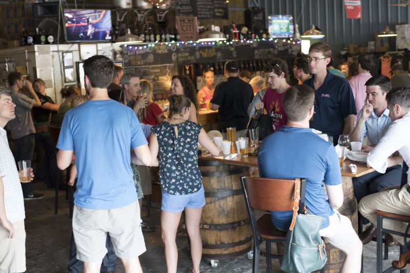 Guests crowded around the bar to pick their Holy City brew of choice.