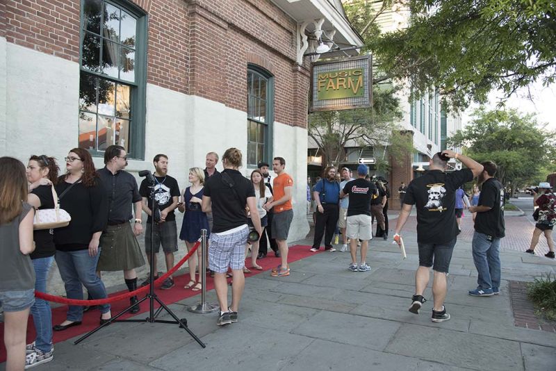 Guests lined up outside the Music Farm before the event.