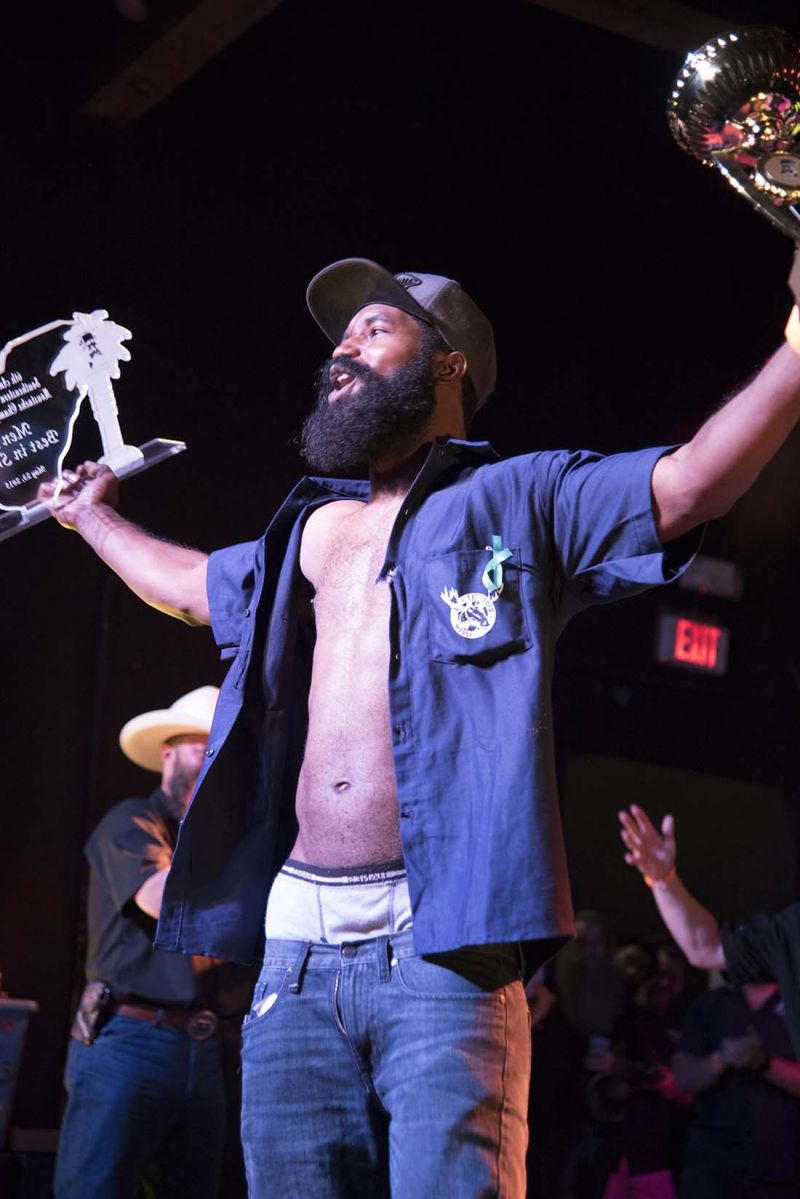 Harold Ervin held his first place trophy for Junior Full Beard (4 inch limit) and his glass award for Best in Show.