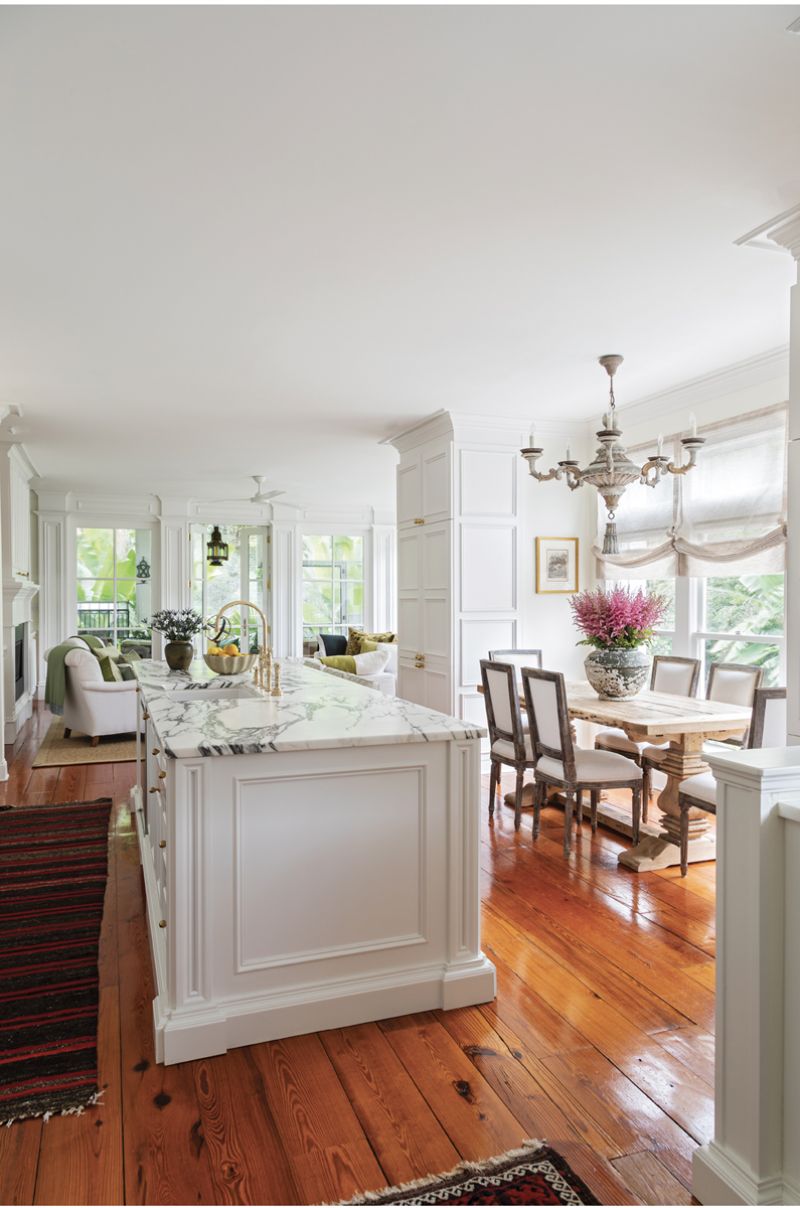 Traditional millwork and reclaimed pine floors balance the new addition’s contemporary scale and modern finishes, making for a seamless architectural transition from old to new.