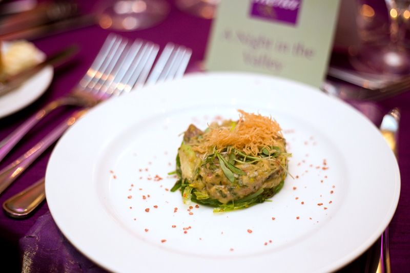 The first course was ahi tuna tartare with avocado and micro cilantro, prepared by students.