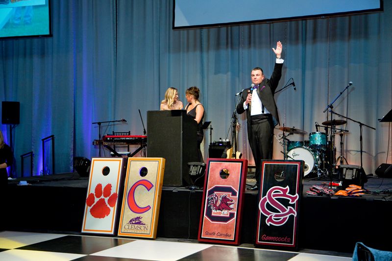 Clemson and USC cornhole boards sold at the live auction