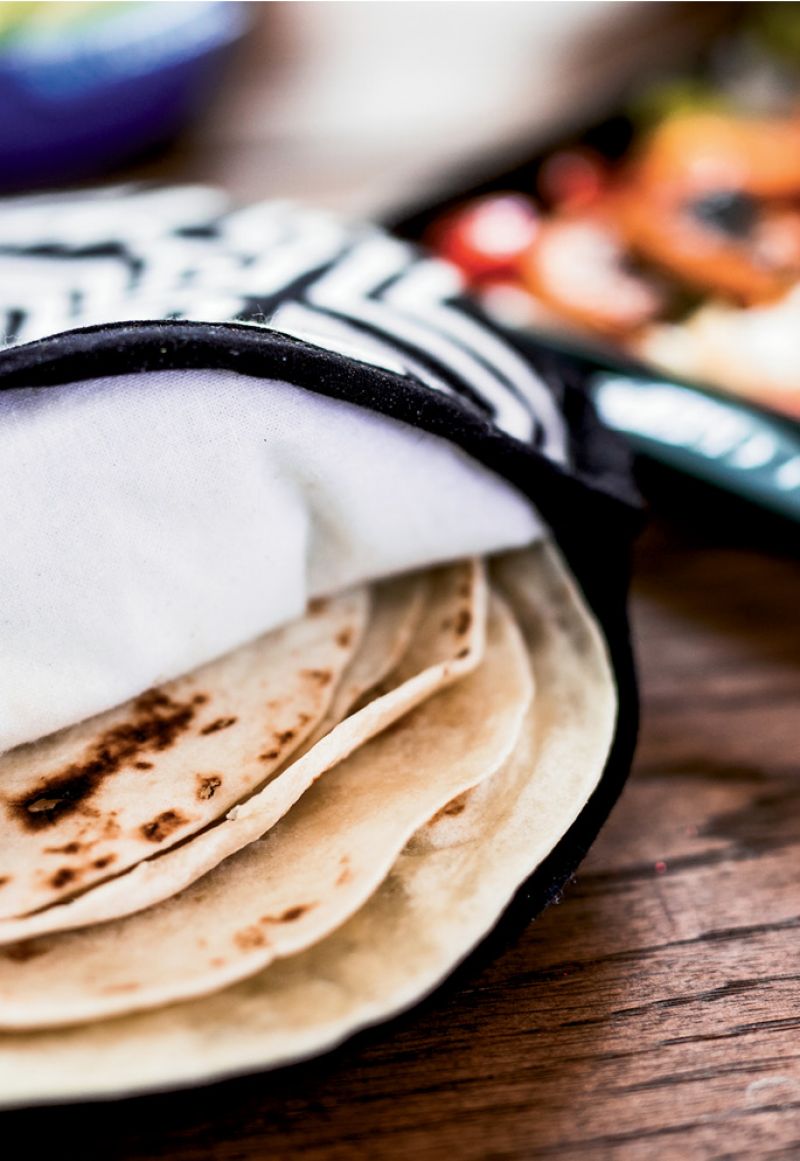 To make tortillas more “bubbly,” MariElena suggests forming the dough into balls and letting them rest for 20 minutes before rolling them out into disks.