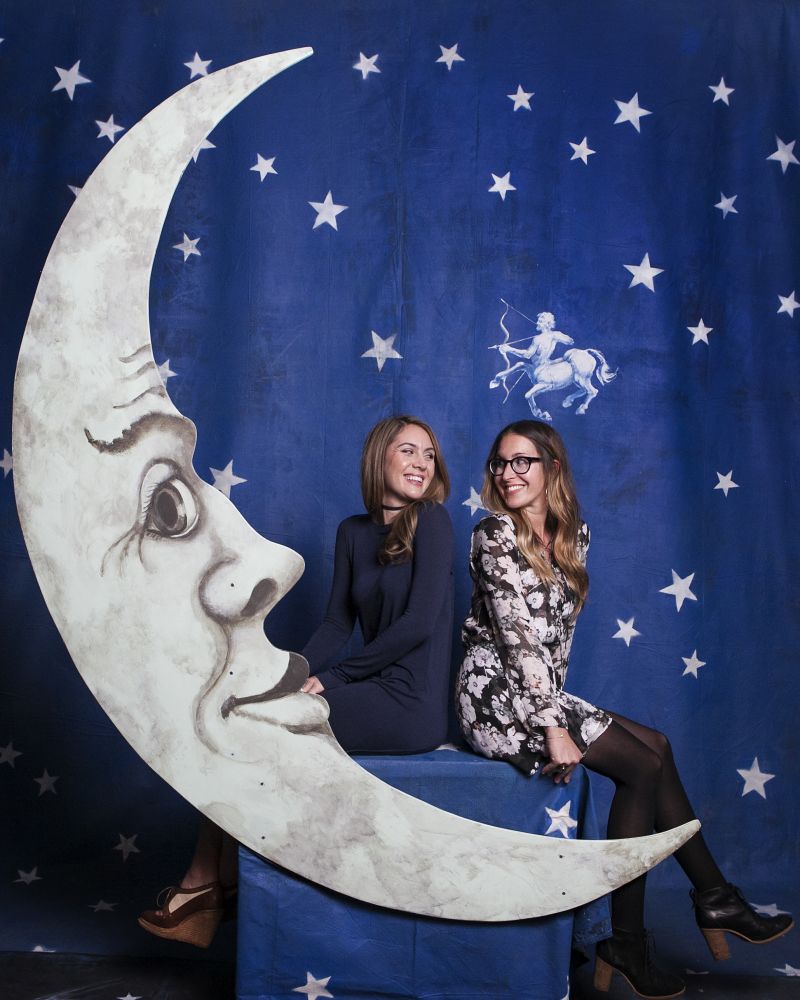 Michelle Hurst and Lisa Roy pose in the signature “Moon Booth.”