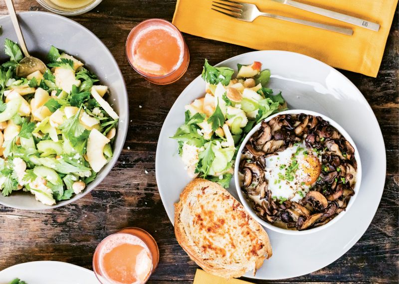 Crusty, cheesy toasts are perfect for dipping into the savory mushroom and egg bake, while a bright apple salad delivers satisfying crunch.