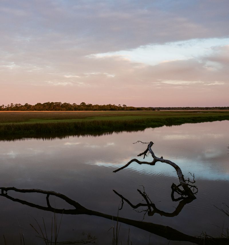 Sunset on Mosquito Creek, where tides rise and fall six to eight feet daily.