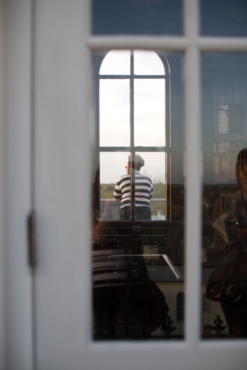 Johnny Caldwell seen through the glass cupola of the mansion.