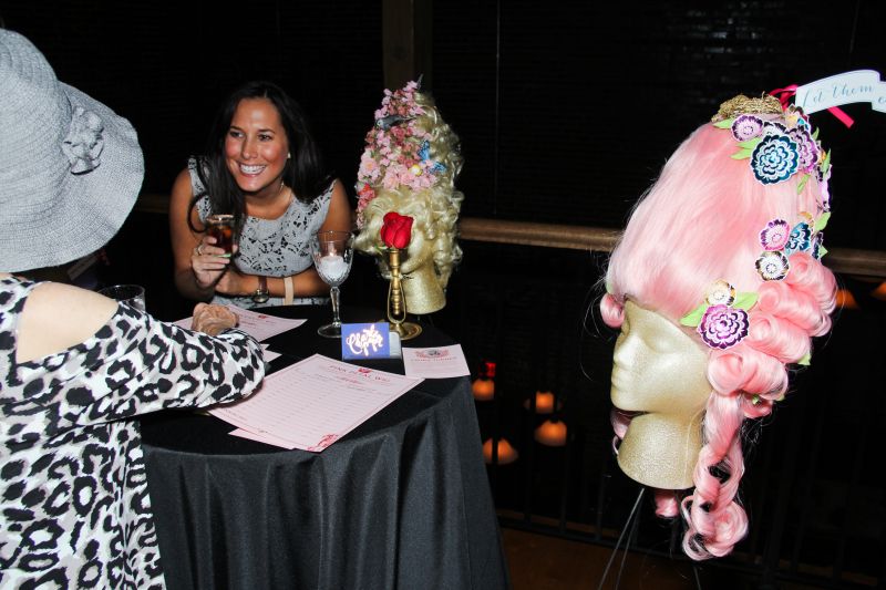 Guests were bidding and chatting about the carefully curled hair masterpieces.