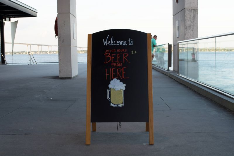A chalkboard sign announces the party, welcoming guests as they arrive.