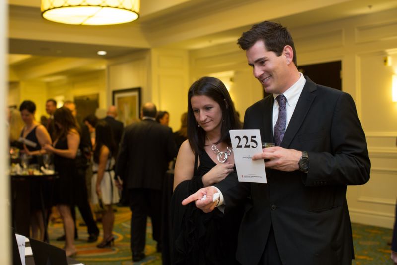 Siblings Melinda Lawson and Trevor Donovan looked over the silent auction items.