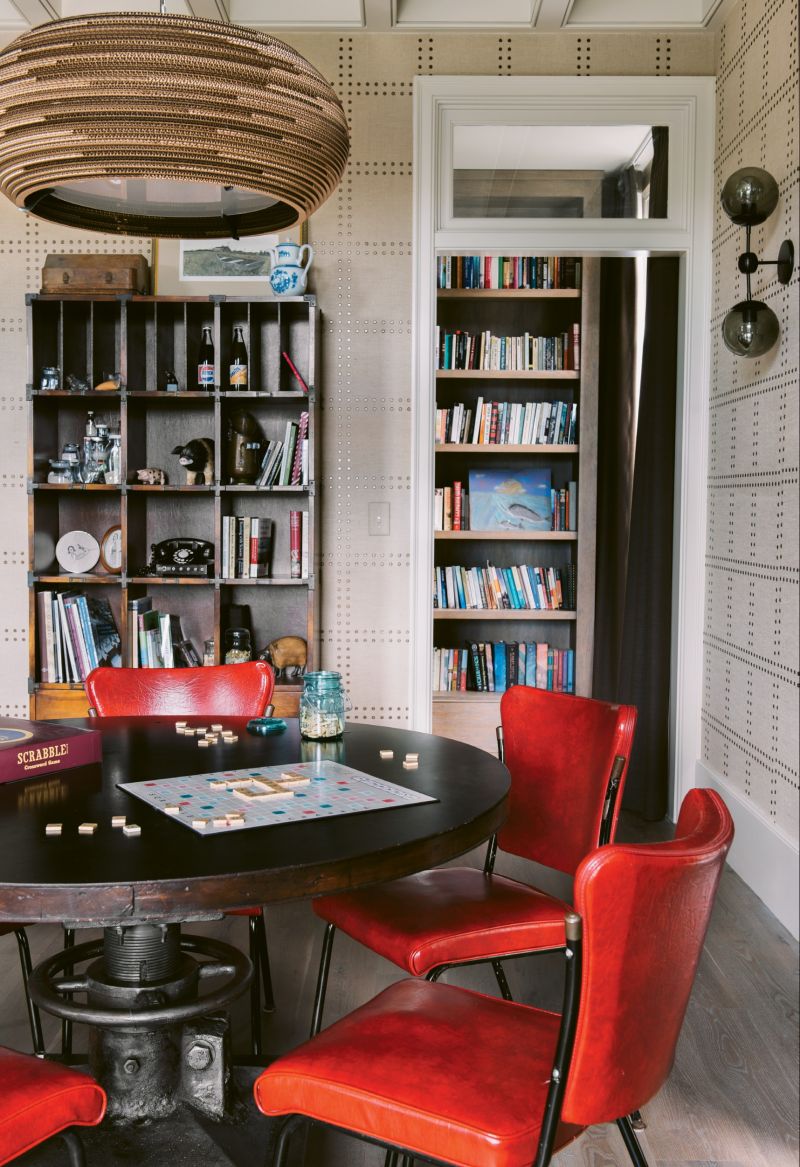 A Graypants chandelier composed of recycled cardboard and a vintage table keep the space grounded.