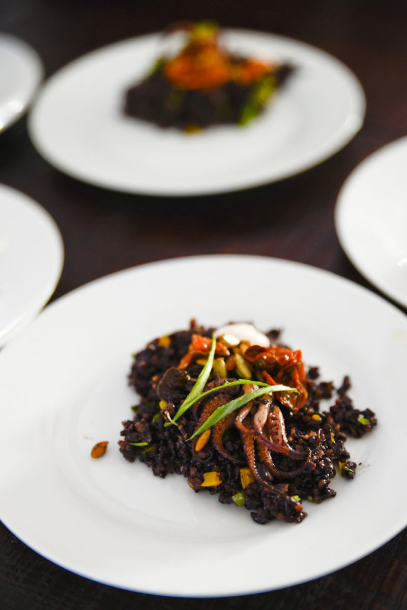 Baby octopus confit on black forbidden rice with oyster mushroom and cured tomato, by Basico