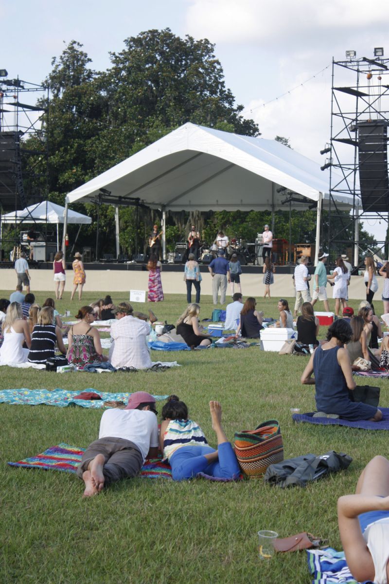 Attendees lounged on the lawn in front of the main stage.