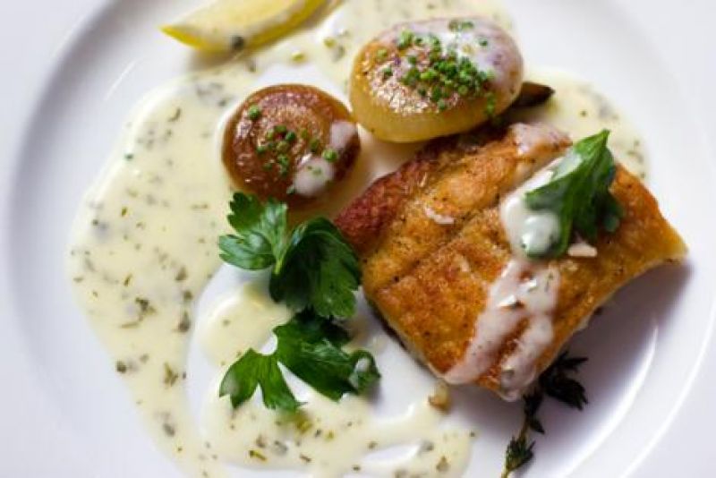 McCrady&#039;s local flounder with baked onion and parsley sauce.